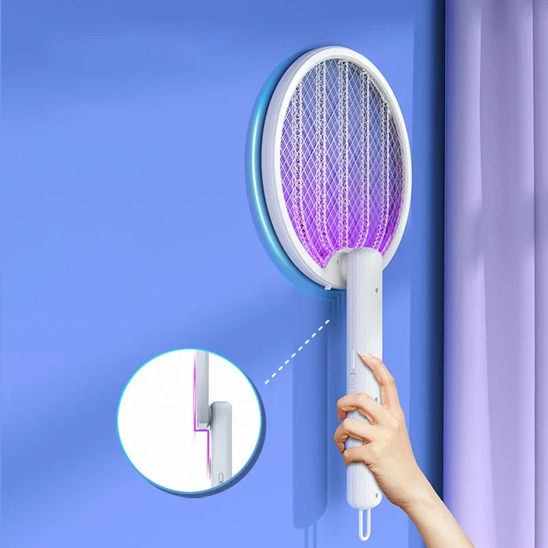 Person using a tennis racket bug zapper indoors