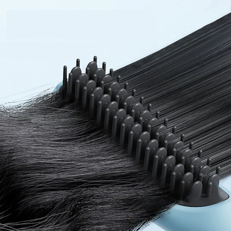 Straightening Comb Brush - Close-up of brush bristles gliding through dark hair to smooth strands