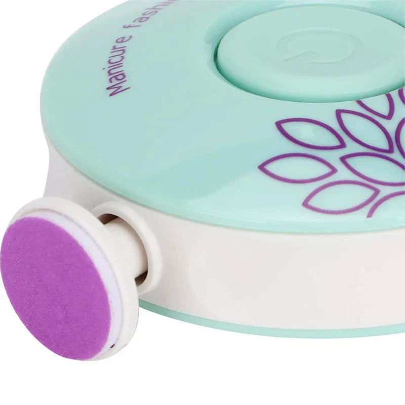 Manicure Pedicure Kit - Angled close-up of a mint and white electric nail care device, with an extended purple textured polishing head mounted on its side.