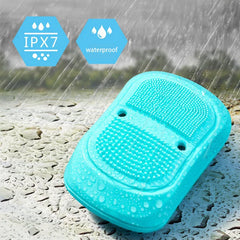 Electric Scalp Massager - Teal unit with IPX7 waterproof rating shown in wet, rainy conditions