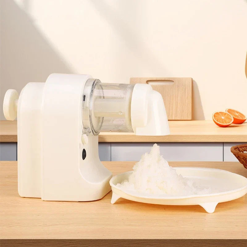 Ice Shaver Machine - Unit placed on wood countertop dispensing fluffy shaved ice into a tray