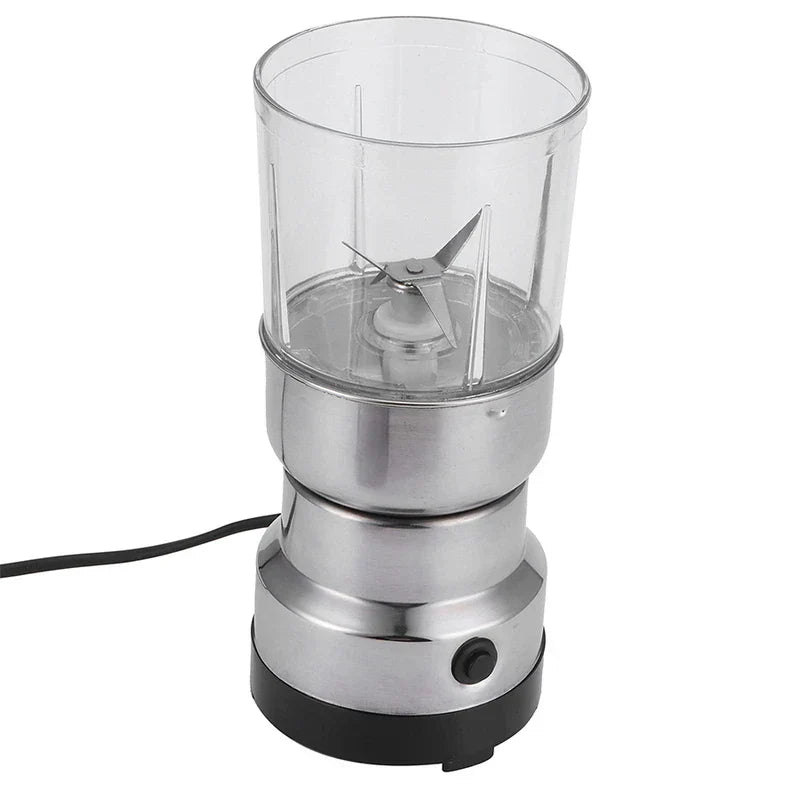 Coffee Spice Grinder - Stainless steel electric grinder with clear grinding chamber, stainless steel blades, single black control button, and attached power cord, shown against a plain white background