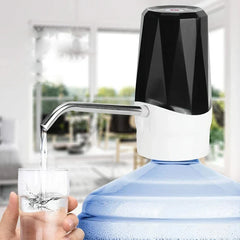 Water Bottle Pump Dispenser - Pump attached to a large blue water jug dispensing water into a held clear glass, bright home interior background