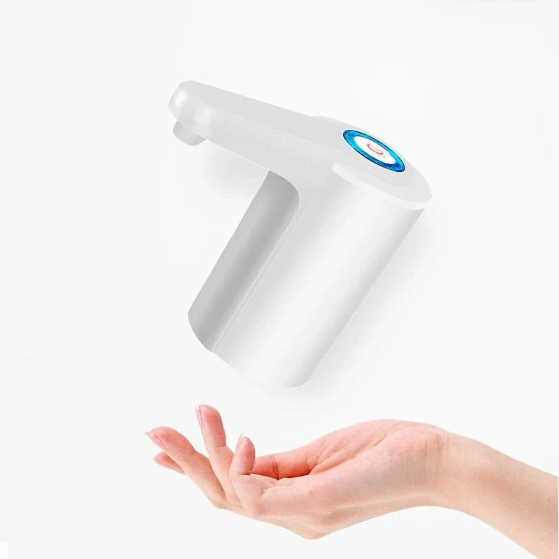 Water Jug Dispenser - White electric water pump dispenser above an open palm held up to receive water