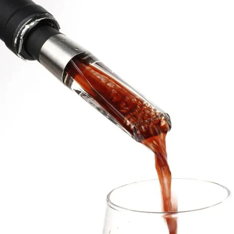 Electric Wine Aerator Pump - Red wine flowing through the aerator pourer as it dispenses into a waiting wine glass