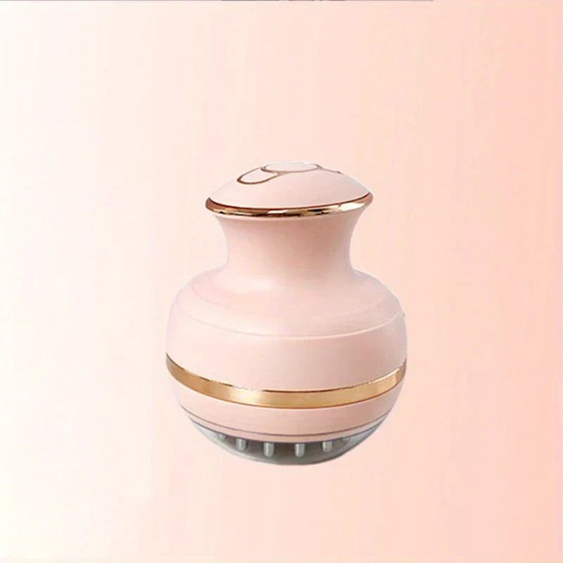 Energy Pen - Pink electric scalp massager with gold trim and soft silicone bristles on a light pink background