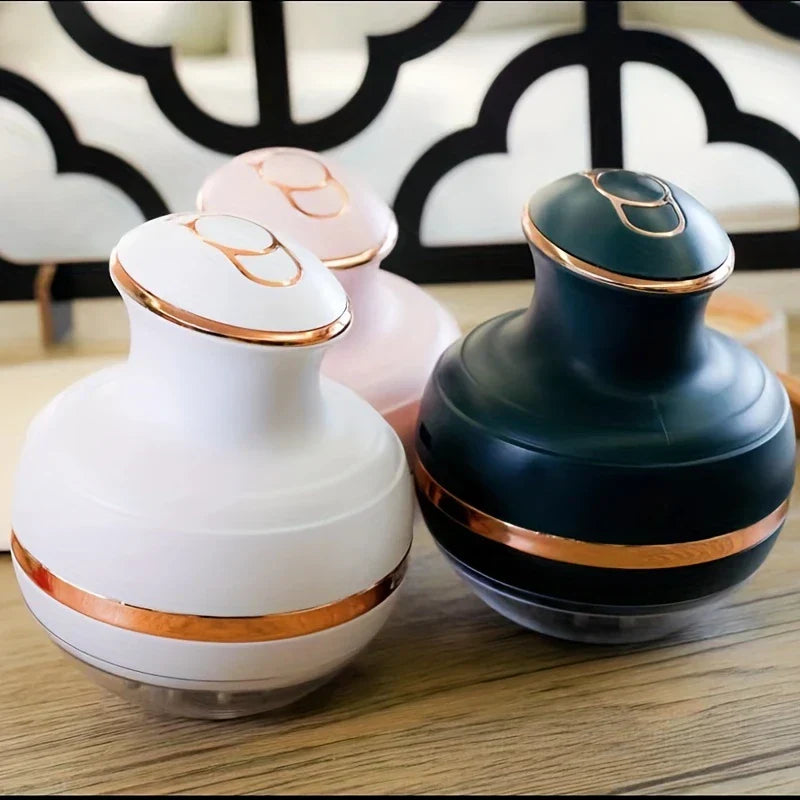 Energy Pen - Three color variants of the handheld wellness device resting on a wood table surface