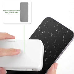 Electronics Cleaning Brush - Hand pressing the white cleaning case against a wet smartphone screen; case back has super fiber fleece