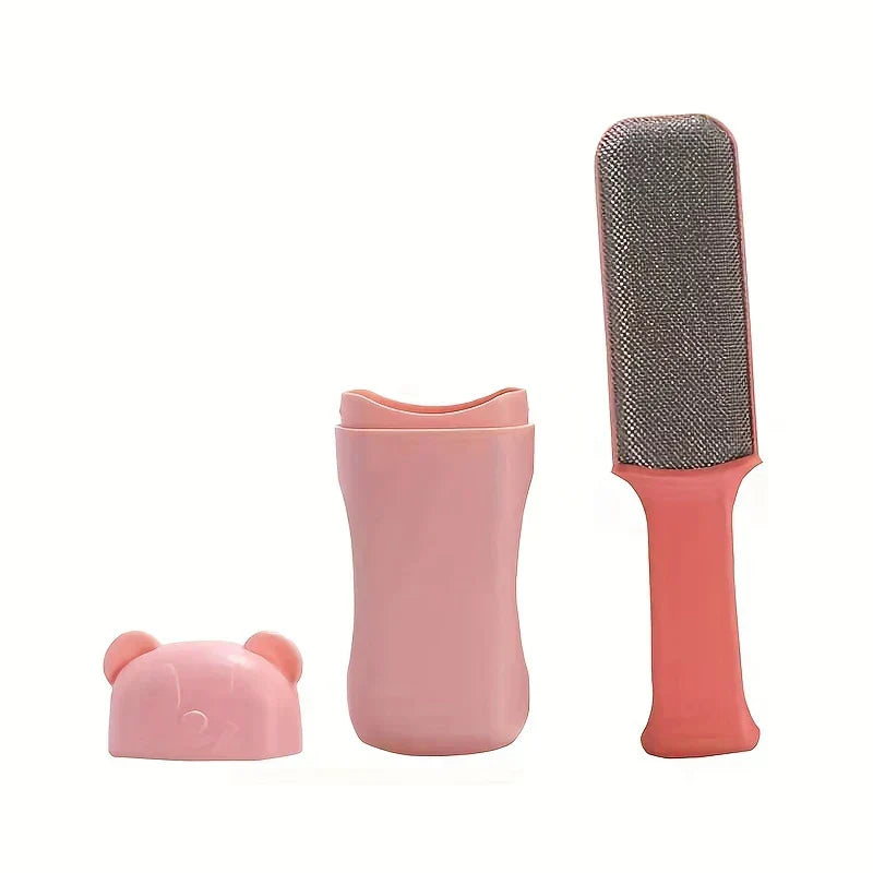 Pink bear-shaped lid, pink holder, and pink handled pet hair remover brush arranged on a white background