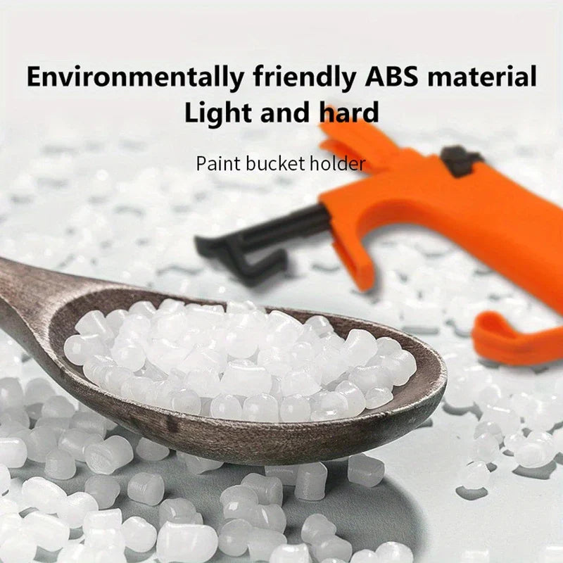 ergonomischer farbdosenhalter - Ein oranger Farbdosenhalter, präsentiert auf ABS-Kunststoffpellets, mit überlagertem beschreibendem Text