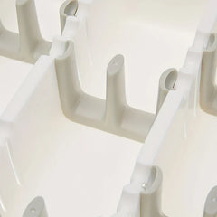 Cutlery Drawer - Close-up partial view of interlocking white and light gray plastic divider components