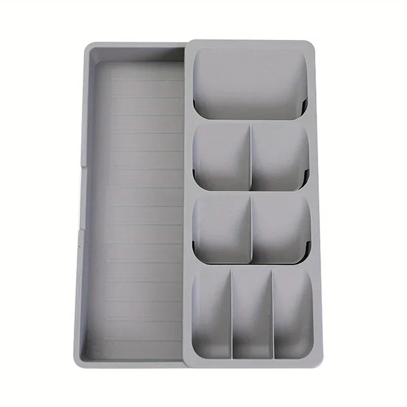 Cutlery Drawer Organizer - Light gray expandable storage tray with divided compartments and extended long storage section, shown against a plain white background