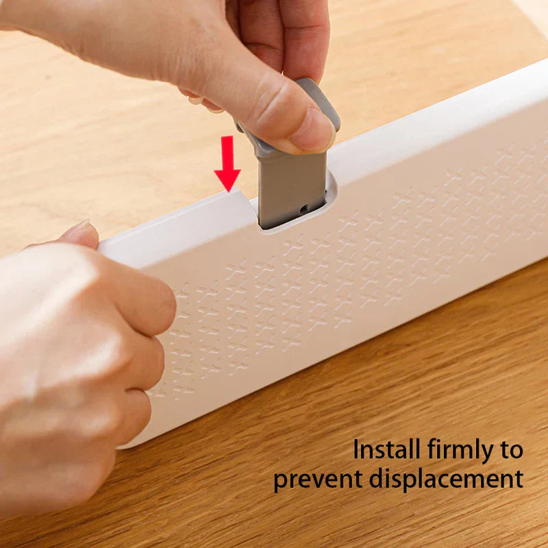 Hands pressing gray lock tab on white closet drawer organizer, with text 'Install firmly to prevent displacement'