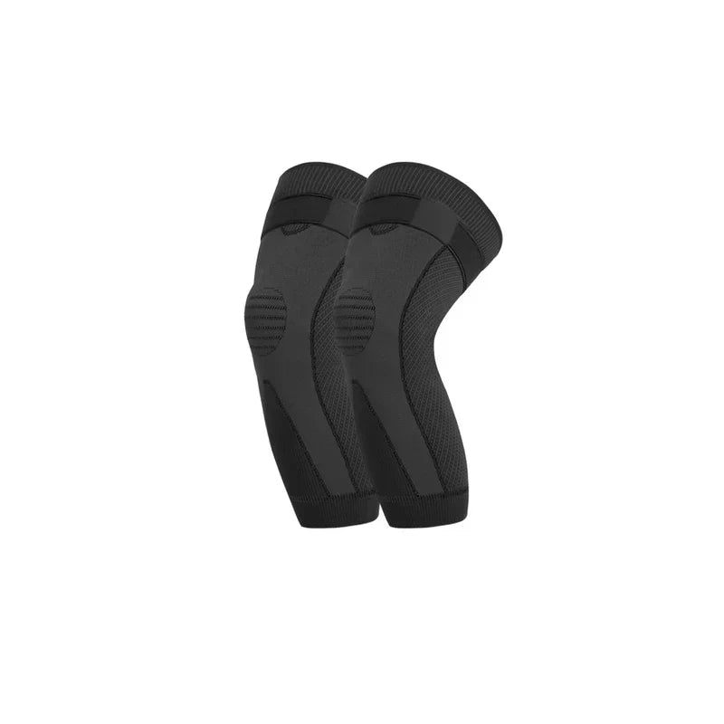 Compression Knee Brace Sleeve - Pair of dark gray long knee braces with black straps and padded patella areas on a plain white background