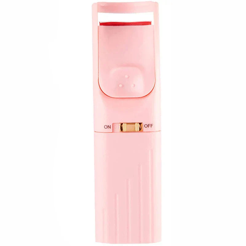 Eyelash Curler - Light pink handheld heated lash tool with on/off switch and red curling pad