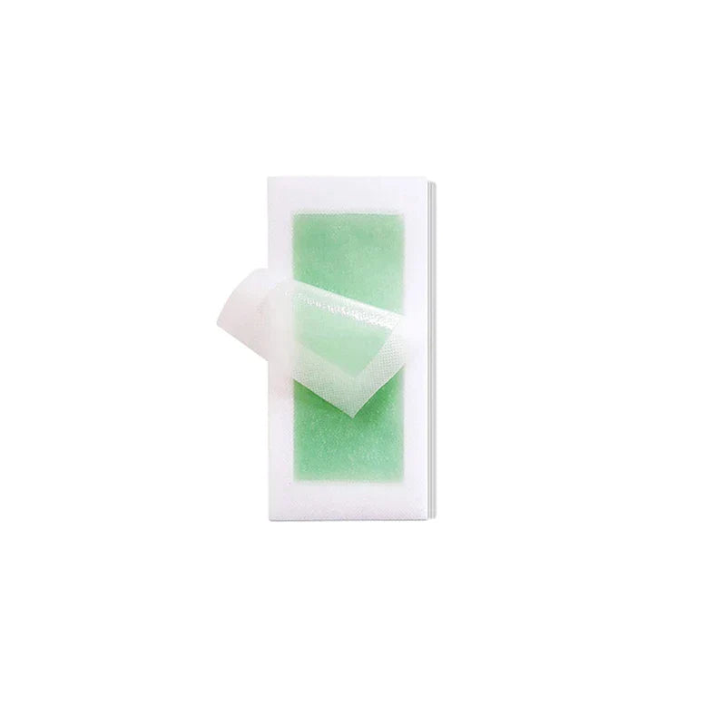 Wax Strips Paper - Stack of pre-waxed facial wax strips with protective film partially peeled back