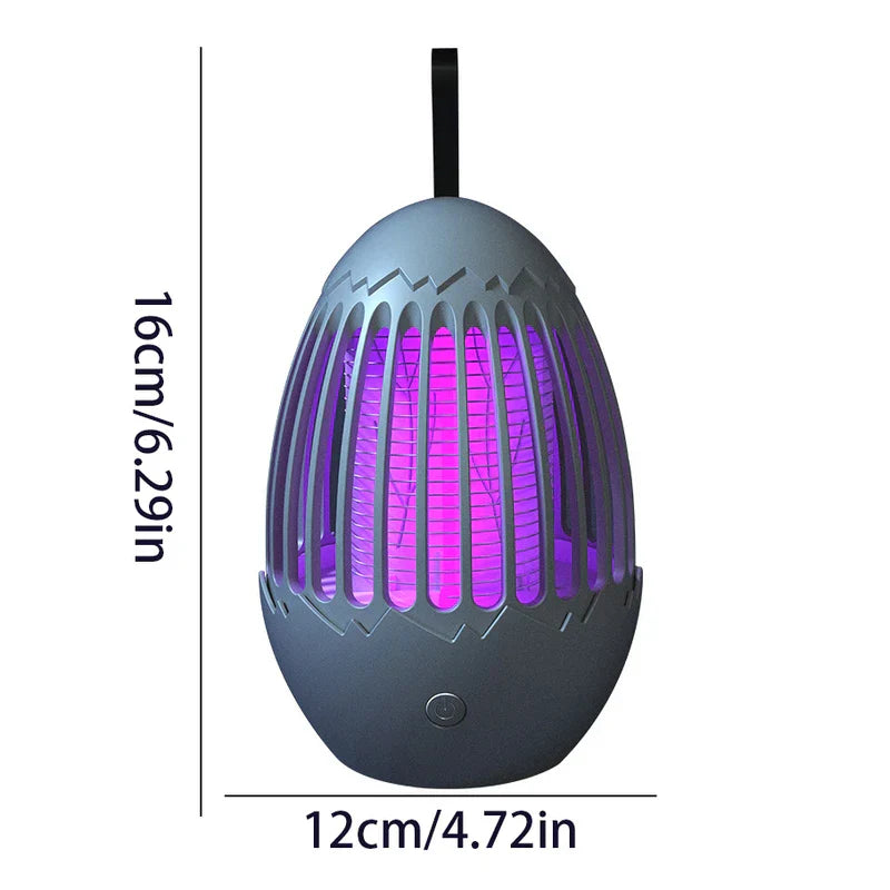 repelente de insectos - Matainsectos gris oscuro con forma de huevo con interior iluminado en púrpura, correa de suspensión y botón de encendido; marcado con 16 cm de alto y 12 cm de ancho
