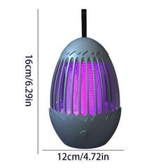 repelente de insectos - Matainsectos gris oscuro con forma de huevo con interior iluminado en púrpura, correa de suspensión y botón de encendido; marcado con 16 cm de alto y 12 cm de ancho