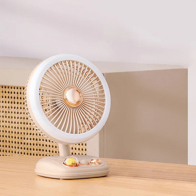 Standing Fan - Cream and rose gold desktop fan placed on light wood surface near rattan and neutral wall paneling