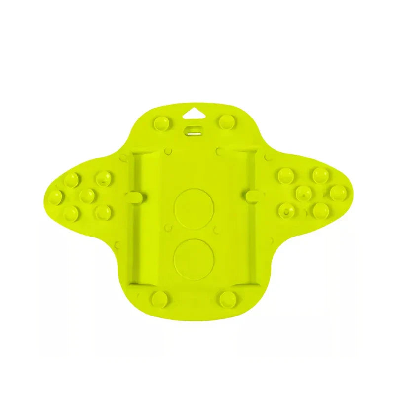 Bright lime green foot scrubber brush with pumice stone exfoliator shown from the bottom with suction cups