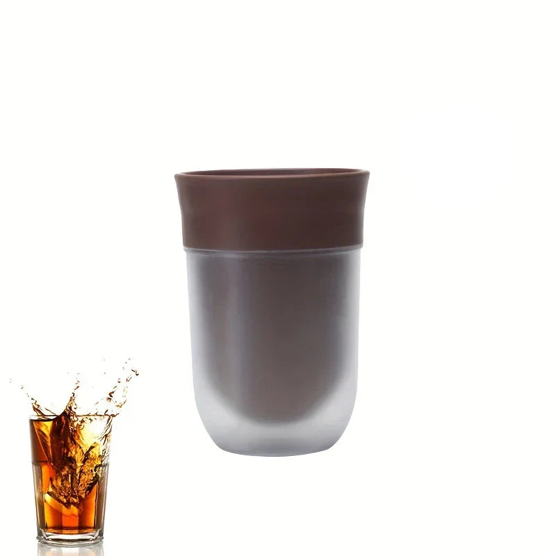 Fruit Infuser Water Bottle - Two-tone brown and frosted tumbler beside a small glass of splashing cola on a white background