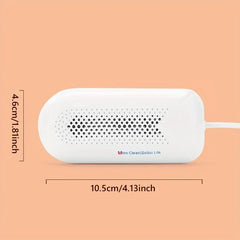Fruit Vegetable Washing Machine - White capsule-shaped electronic device with attached cord, showing 4.6cm height and 10.5cm length dimension markings on a peach background
