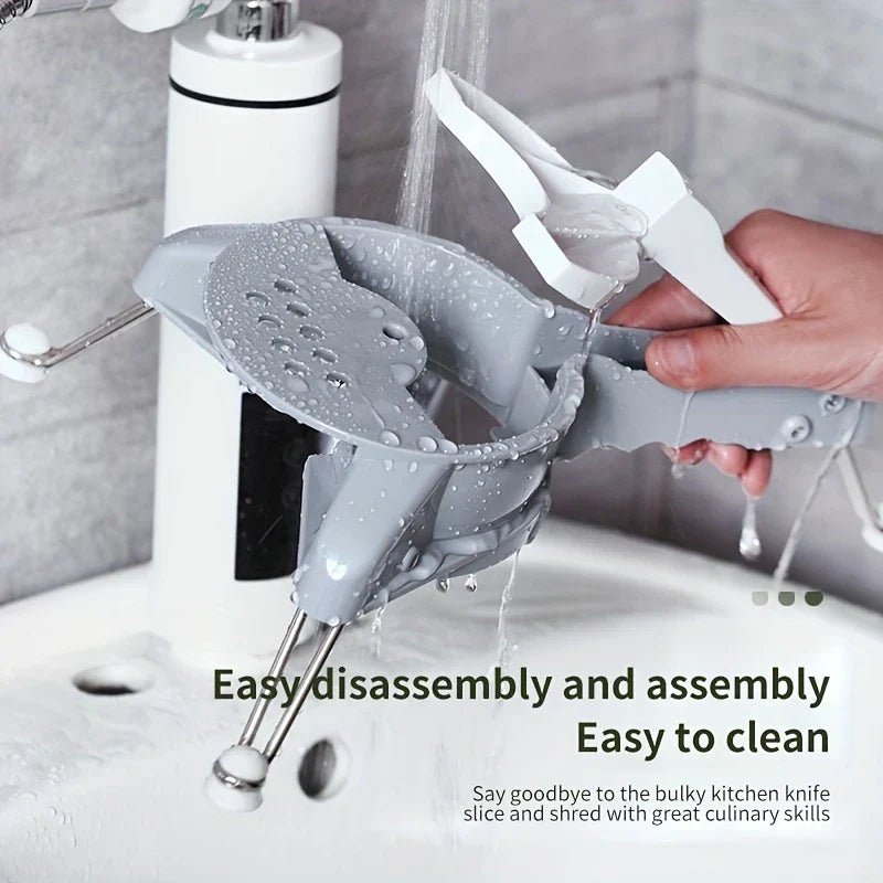 Fullstar Vegetable Chopper - Hand holding a disassembled slicer under running faucet water to clean it