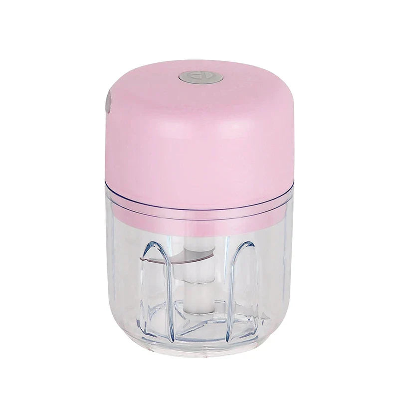 Pink and clear mini electric food chopper on a white background