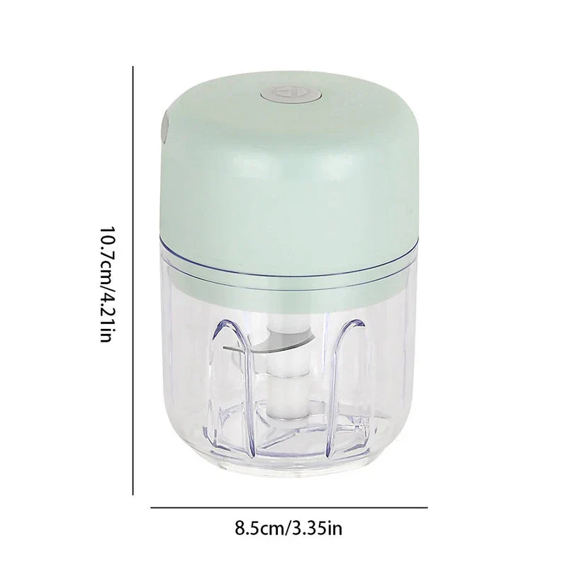 Light green small electric kitchen chopper with transparent cup shown with size dimensions on a white background.