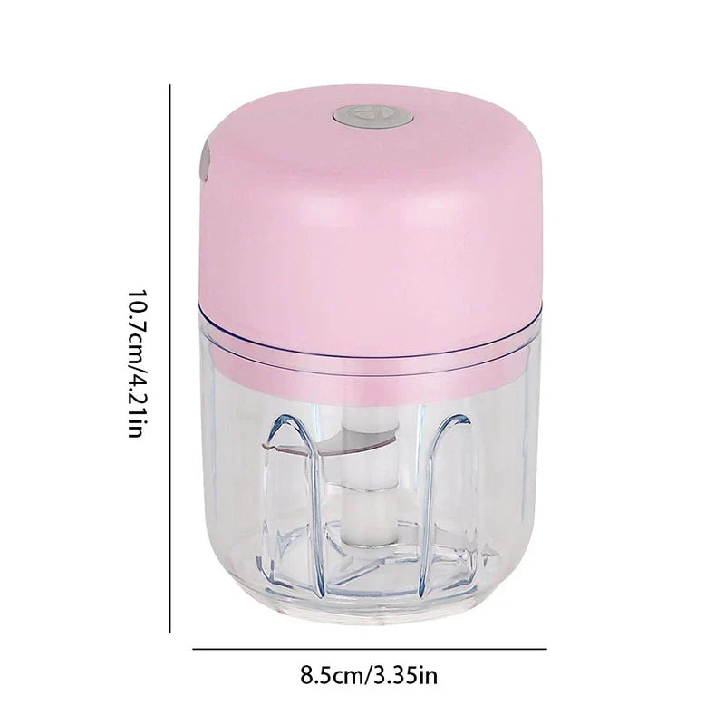 Pink electric mini food chopper with transparent cup, height 10.7cm, width 8.5cm, shown against white background