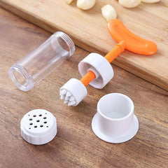 Garlic Press - Disassembled garlic prep tool showing all separate component parts laid out on a wood surface