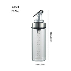 Glass Cruet - 600ml clear glass oil bottle with measurements, dispensing top and silver collar; height 18cm, width 5cm.