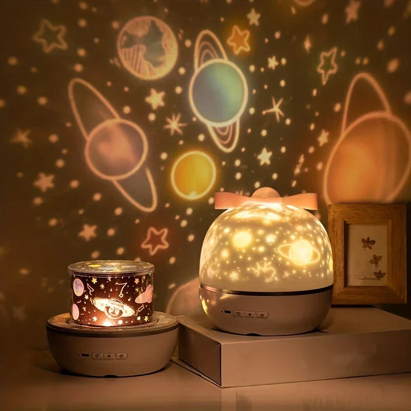 Star Projector Night Light - Two projector units displayed with warm celestial projection of planets and stars cast on the wall behind them