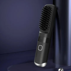 Hair Straightener Brush - Slanted view of a black heated hair brush leaning against a dark cylindrical object on a matching dark surface