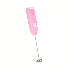 Handheld Electric Milk Frother - Pink battery-powered drink whisk with coiled metal mixing head, shown against plain white background
