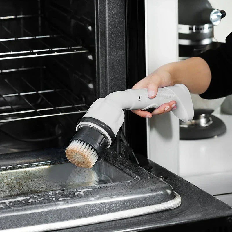 Cordless power scrubber cleaning a tile surface