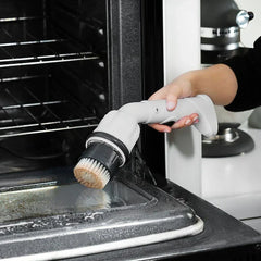 Cordless power scrubber cleaning a tile surface