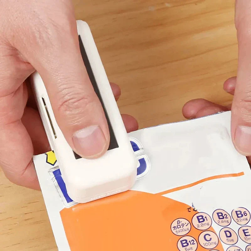 Handheld Heat Sealer - Sealer being used to reseal a printed supplement snack bag
