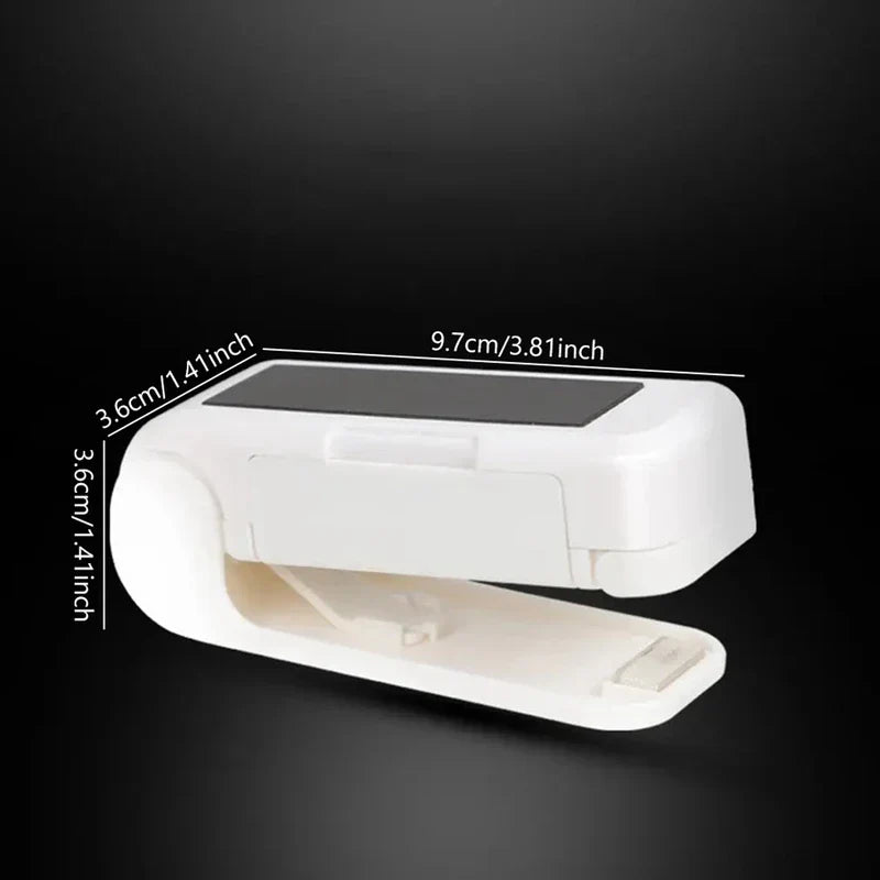 Handheld Heat Sealer - Open white handheld mini sealer with dimension labels displayed against a black background