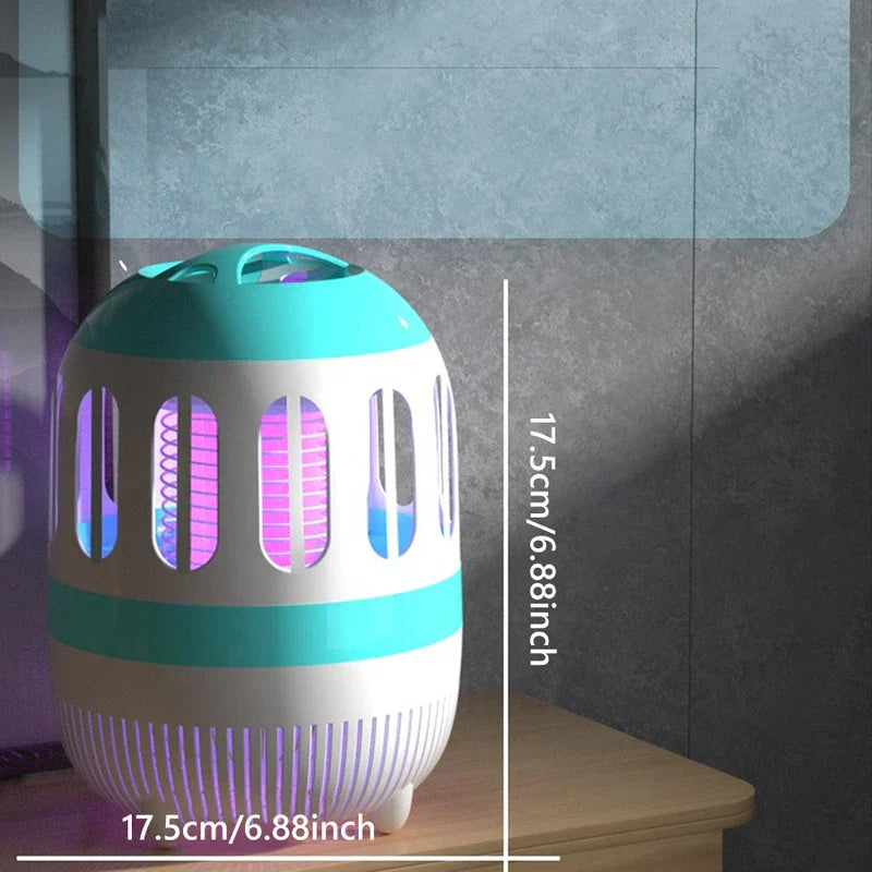 Fly Swatter Zapping Racket - A compact white and turquoise electric bug zapper on a wooden surface with height and width dimensions marked at 17.5cm/6.88inch