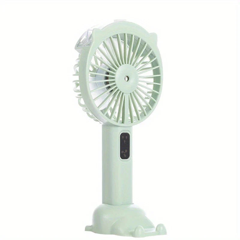 Handheld Misting Fan - Light green handheld fan with cat ear accents and cat paw shaped base, facing right, against white background