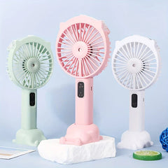 Handheld Misting Fan - Three color options (mint green, pink, white) displayed upright on their bases