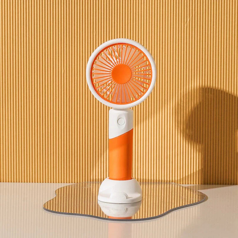 Mini Fan - Orange and white handheld fan on an irregular mirror, vertical ribbed yellow background