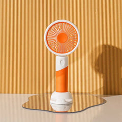Mini Fan - Orange and white handheld fan on an irregular mirror, vertical ribbed yellow background