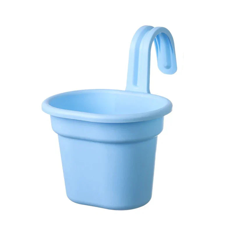 Basket Planter - Light blue plastic hanging planter with curved hook, shown on a plain white background