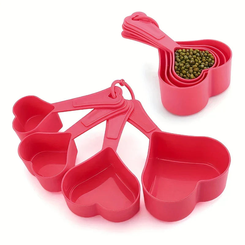 Measuring Spoons - Fanned out bright pink heart-shaped 4-piece kitchen measure set, with one nested set holding mung beans