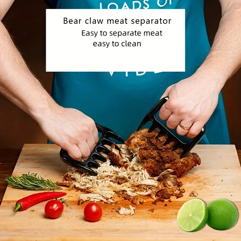Pulled Pork Shredder Claws - Person using two black bear claw meat separators to shred cooked meat on a wooden cutting board with fresh ingredients placed nearby