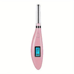 Pink electric heated eyelash curler with clear protective cap over its comb head
