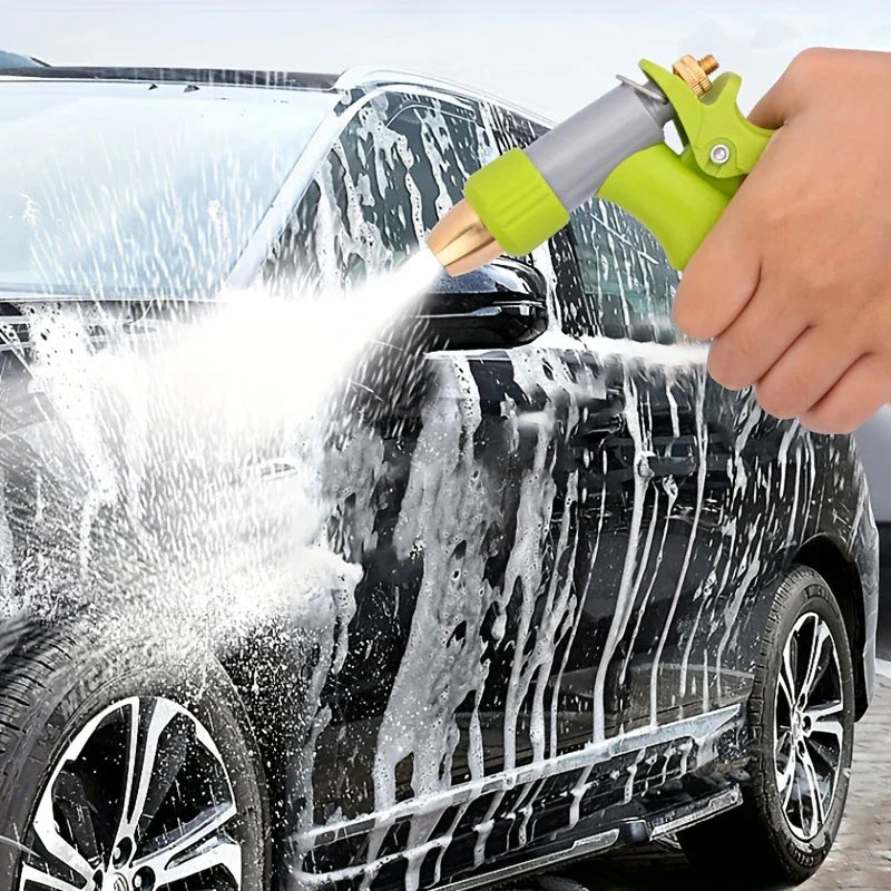Garden Hose Sprayer - Hand holding a green and gray spray nozzle to rinse soap off a black car.