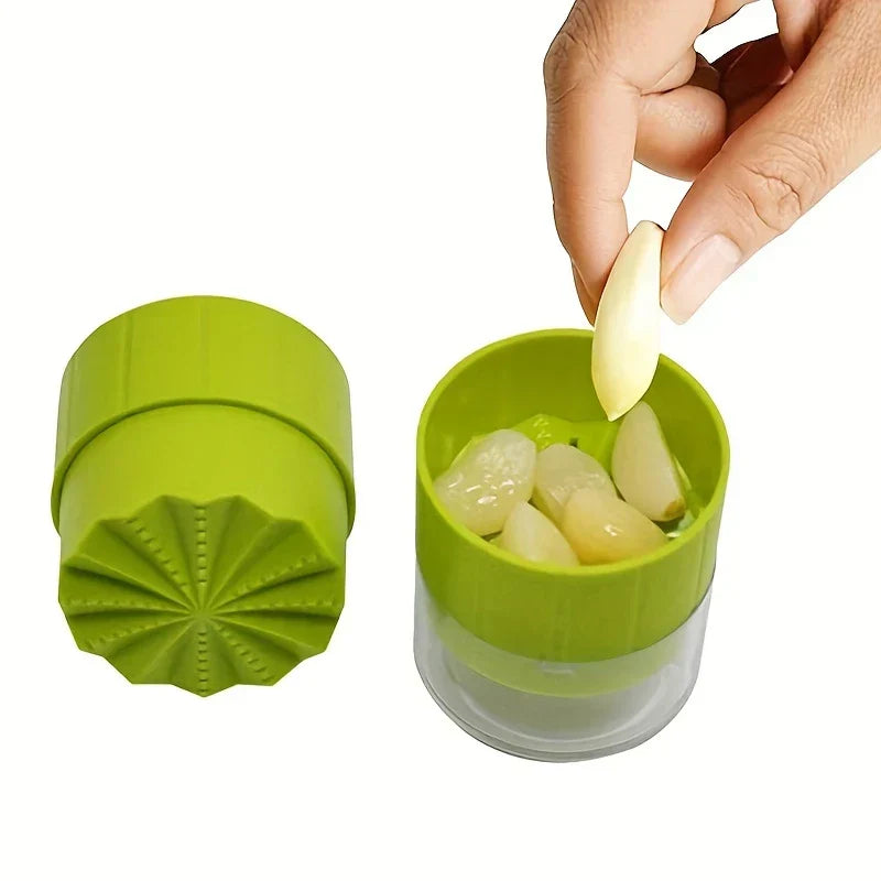 Garlic Press Mincer - Hand placing a peeled garlic clove into an open manual garlic crusher with peeled garlic inside